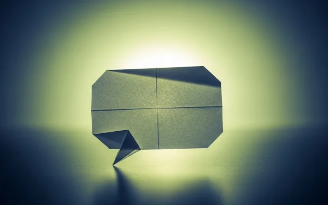 An origami paper speech bubble, representing getting cited by AI search tools